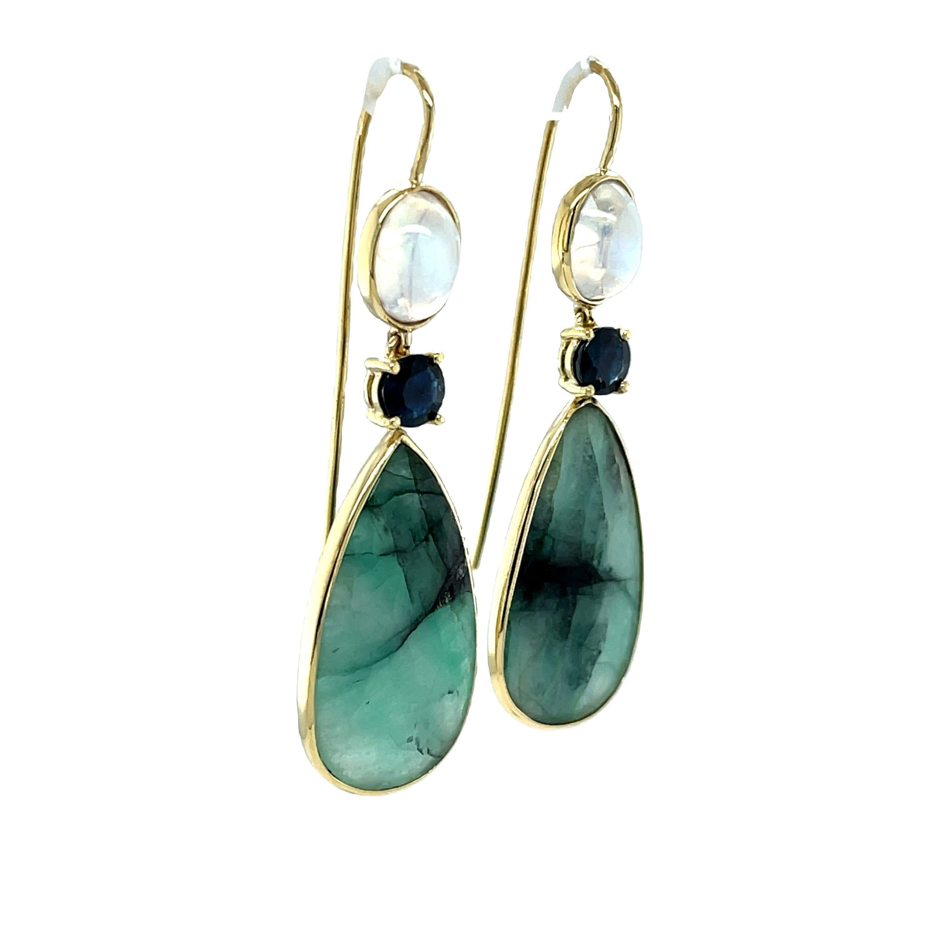 These dramatic 18k yellow gold drop earrings feature a striking combination of colors, shapes and textures! Two pear-shaped varigated emerald 