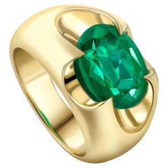 SPEAR TIP RING Yellow gold with an oval emerald at the centre by Liv Luttrell