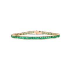 Pulsera tipo «tenis» con esmeraldas talladas en cuadrado, engastadas en oro amarillo de 18 quilates