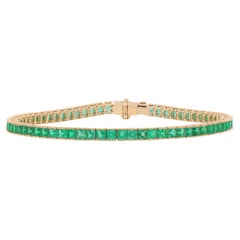 Pulsera tipo «tenis» con esmeraldas talladas en cuadrado, engastadas en oro amarillo de 18 quilates