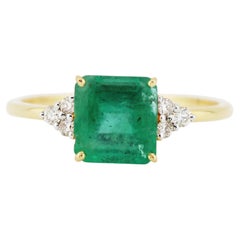 Anillo Esmeralda Cuadrada y Diamante en Oro Amarillo de 18 K