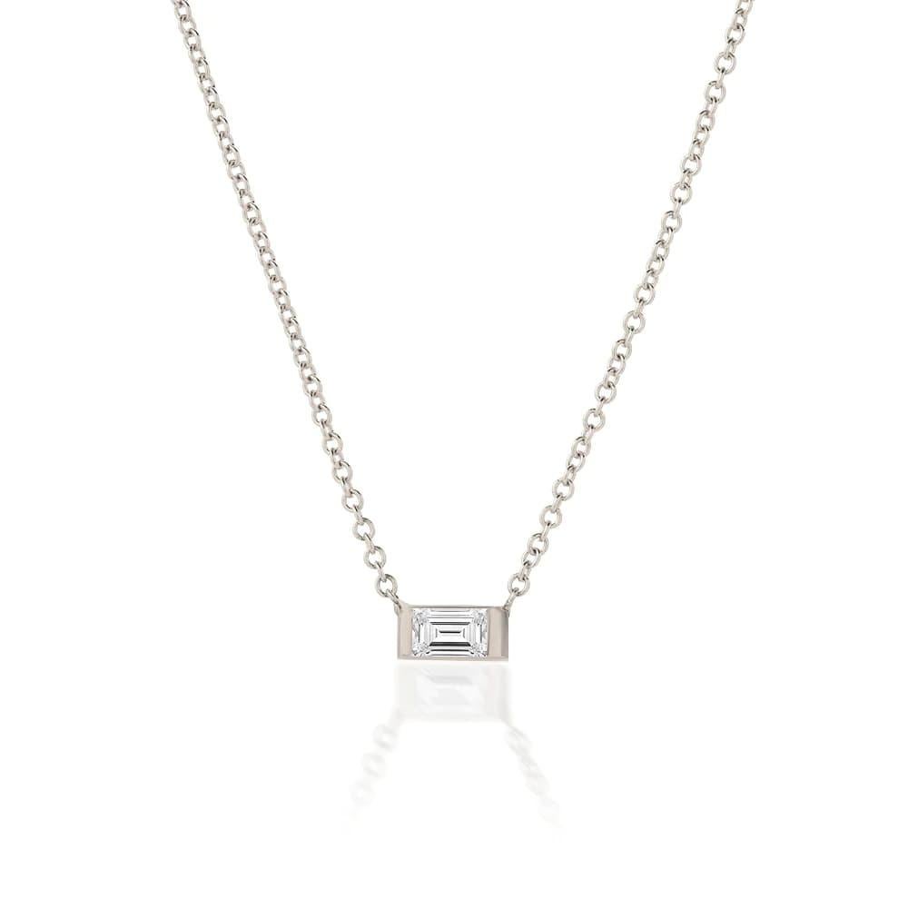 This elegant Emerald Stone Diamond 14K Gold Charm Necklace showcases a timeless design with a luxurious 14K gold setting. Available in yellow, rose, or white gold, it features dazzling diamonds that perfectly complement the rich hue of the emerald.