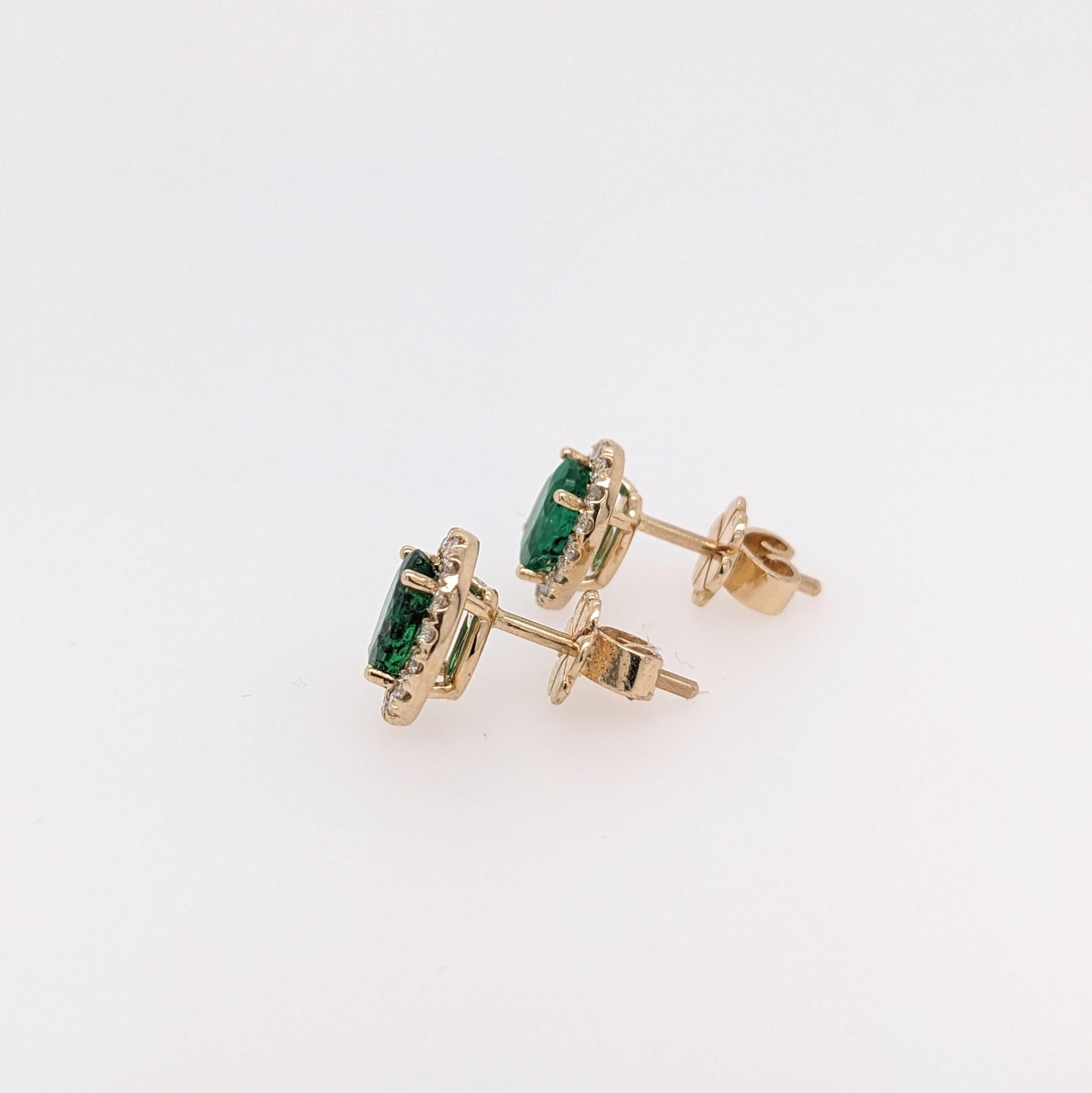 This sparkling earring set features a pair of vibrant earth mined emeralds with a pave diamond halo. A stunning pair of stud earrings designed perfectly for an eye catching engagement or anniversary. These earrings also make a beautiful birthstone