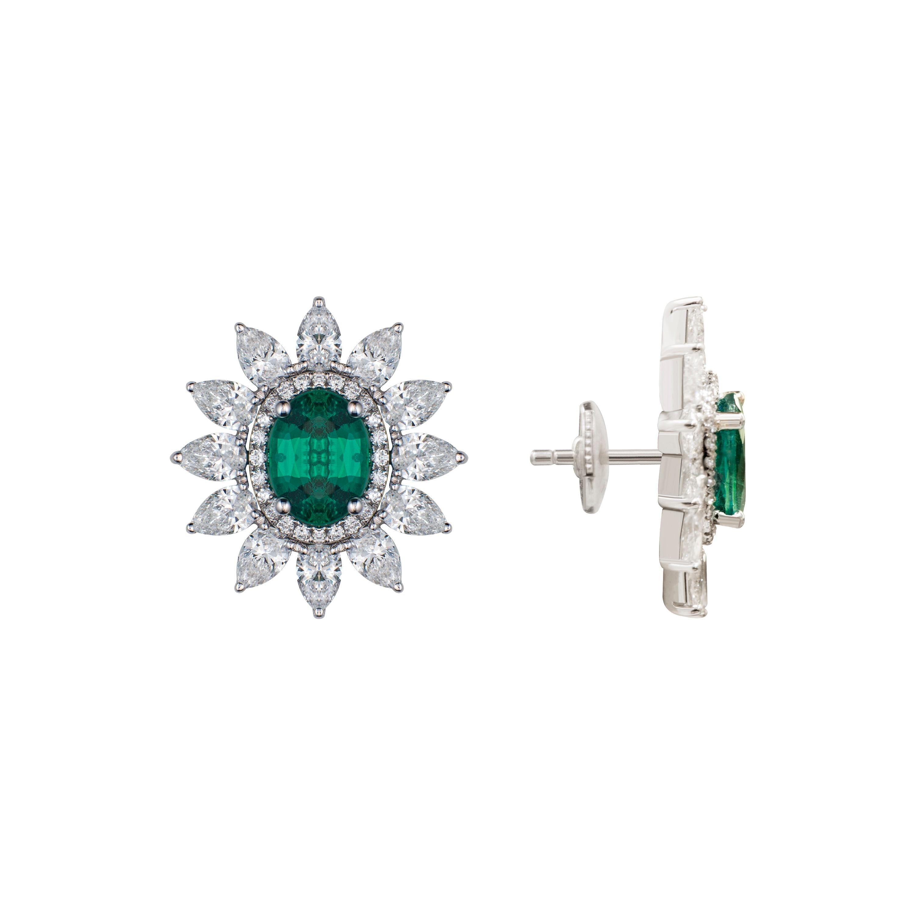 These innovative earrings allow you to wear them in two different combinations. The halo of pear shaped diamonds is detachable. The emeralds in the center can either be worn by themselves or with the halo making this piece a versatile option for a