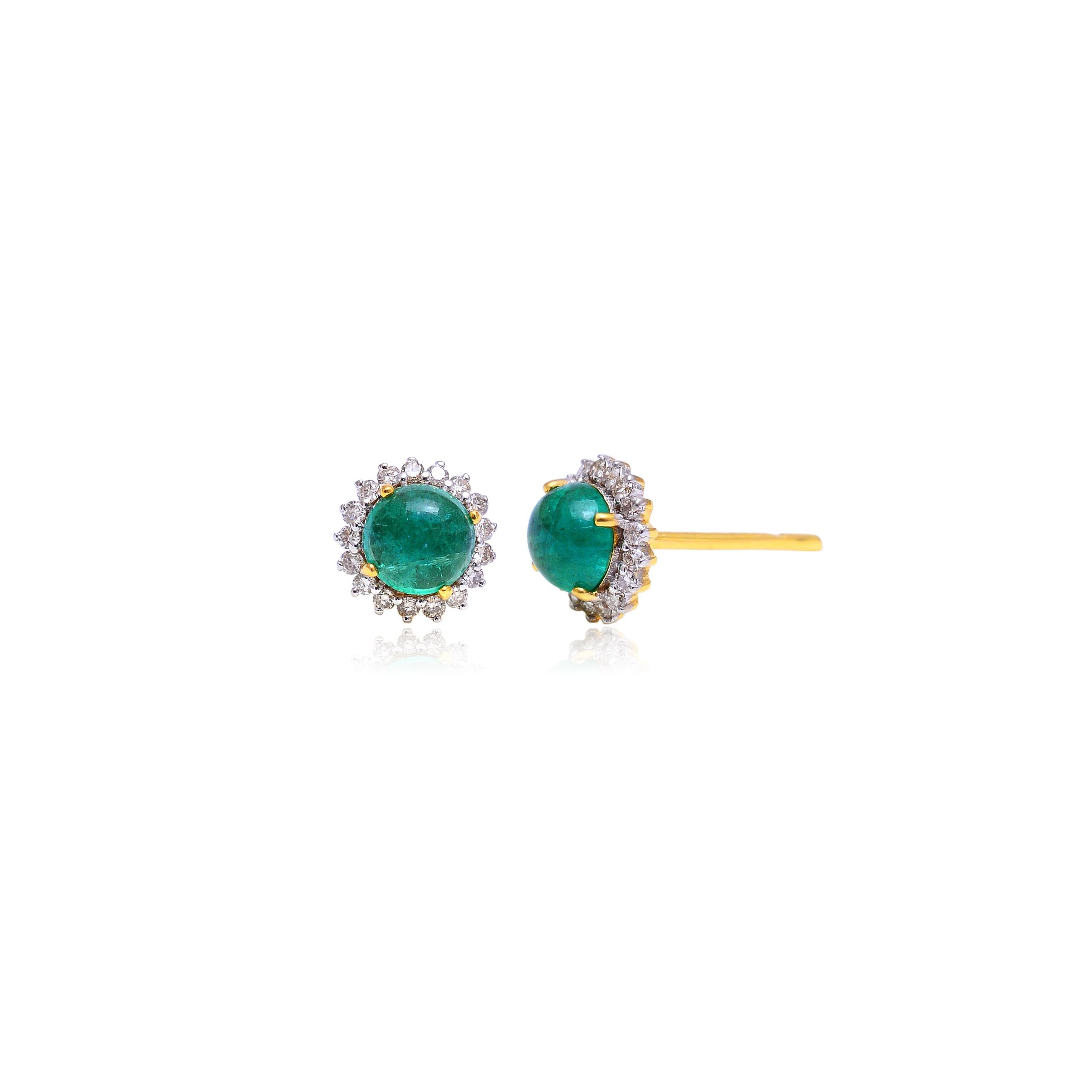 These earrings are made with emerald gemstones and diamond. They are set in 14K gold. Shine all day long in this delicate pair of stud earrings. Perfect for gifting, they twinkle with timeless elegance. Easy to mix and match with other jewellery