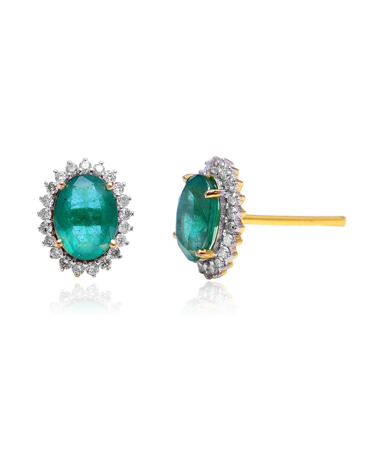 These earrings are made with emerald gemstones and diamond. They are set in 18K gold. Shine all day long in this delicate pair of stud earrings. Perfect for gifting, they twinkle with timeless elegance. Easy to mix and match with other jewellery