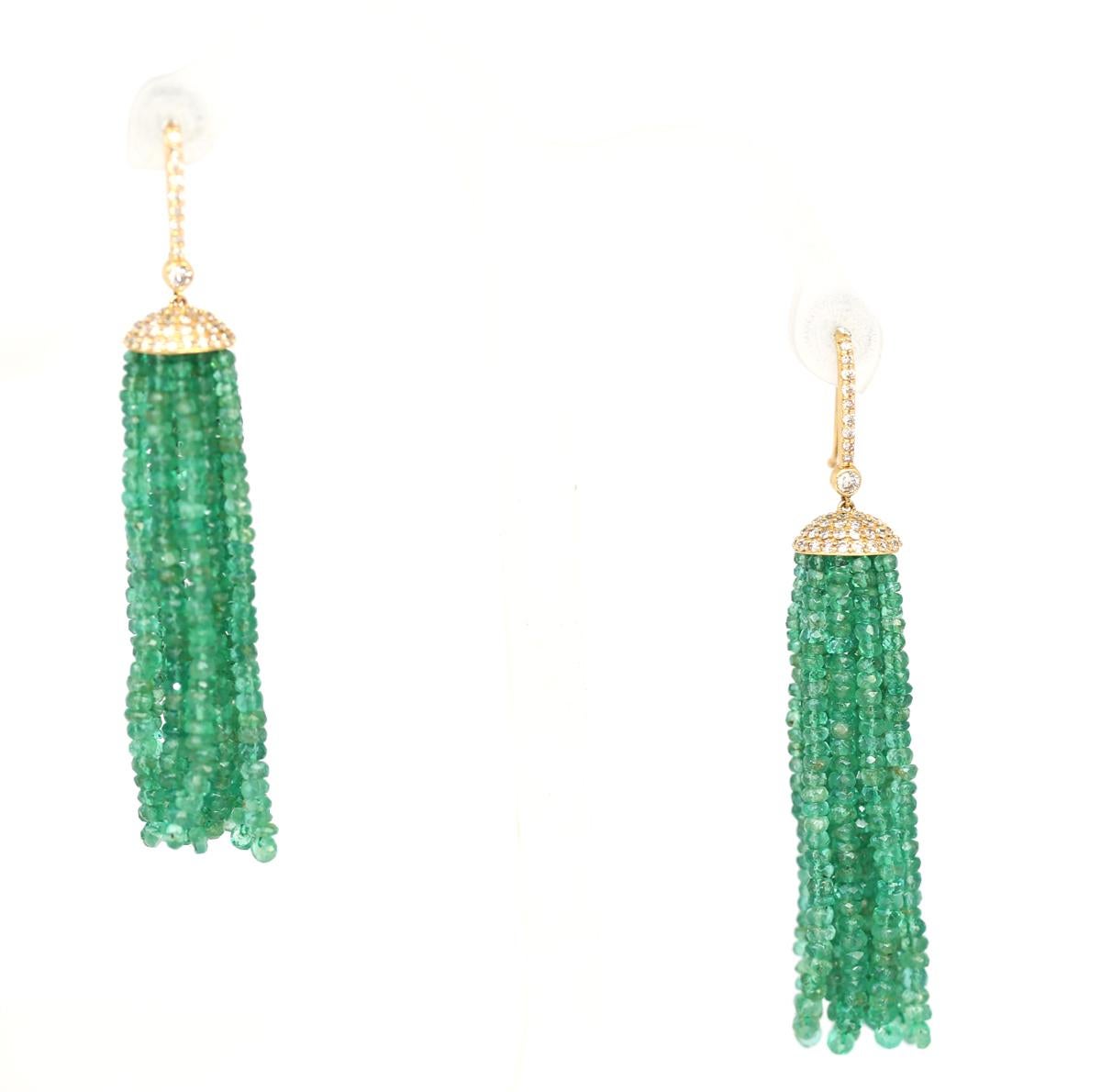 A pair of Emerald Tassels Beads and Diamond Earrings Yellow Gold 14 Karat. 1970-es design and fashion. Each is designed as tassels of Emerald beads, which move freely with the motion of the head.
Measuring approximately 2.35 - 2.90 mm in diameter.