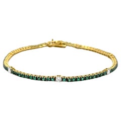 Bracelet tennis en or jaune 18 carats avec émeraudes et diamants 2,02 carats