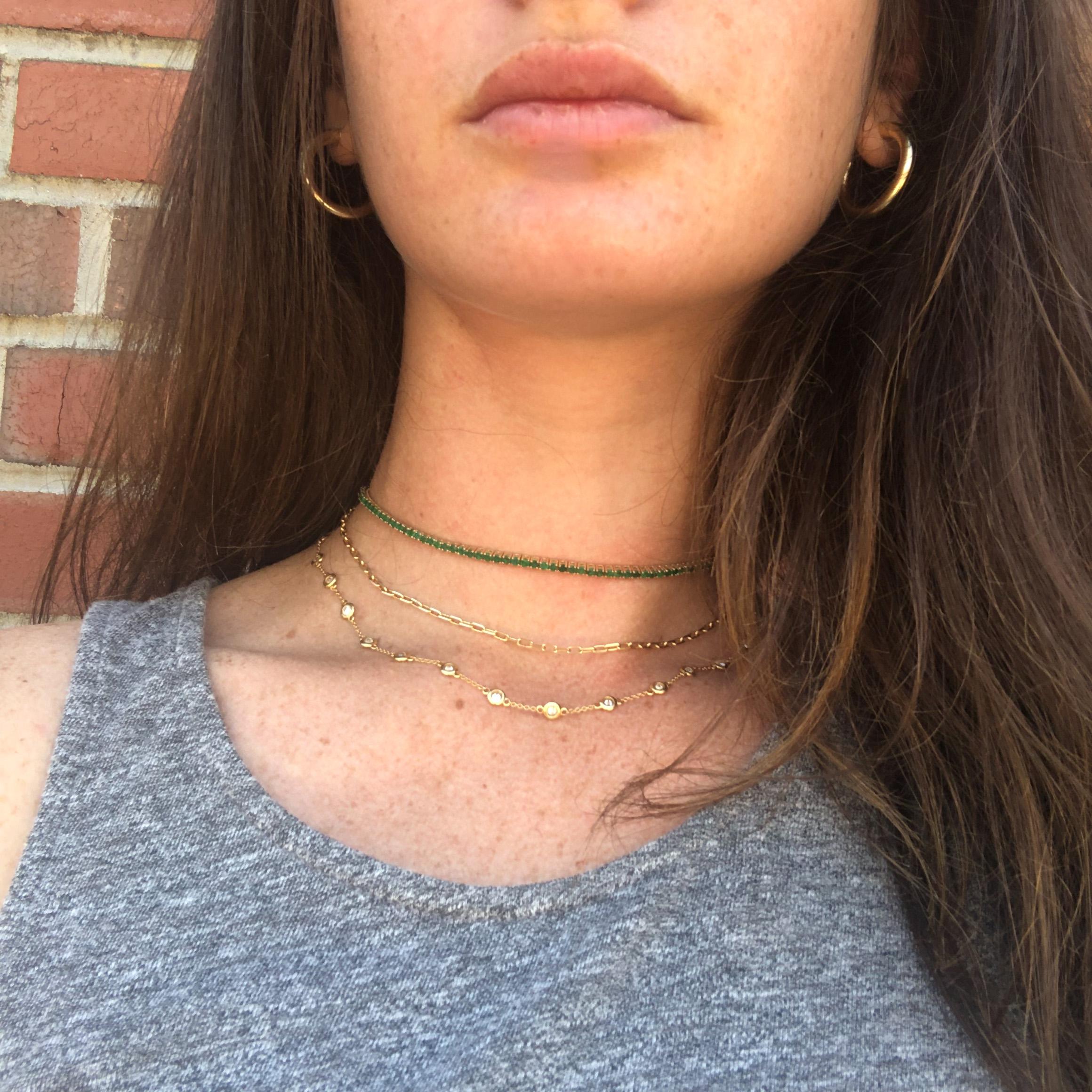 This green tennis necklace is the perfect way to brighten up any day. Made with deep, green emeralds from India and styled off of a traditional tennis bracelet style. This green tennis necklace that can be layered or worn on its own. It's the
