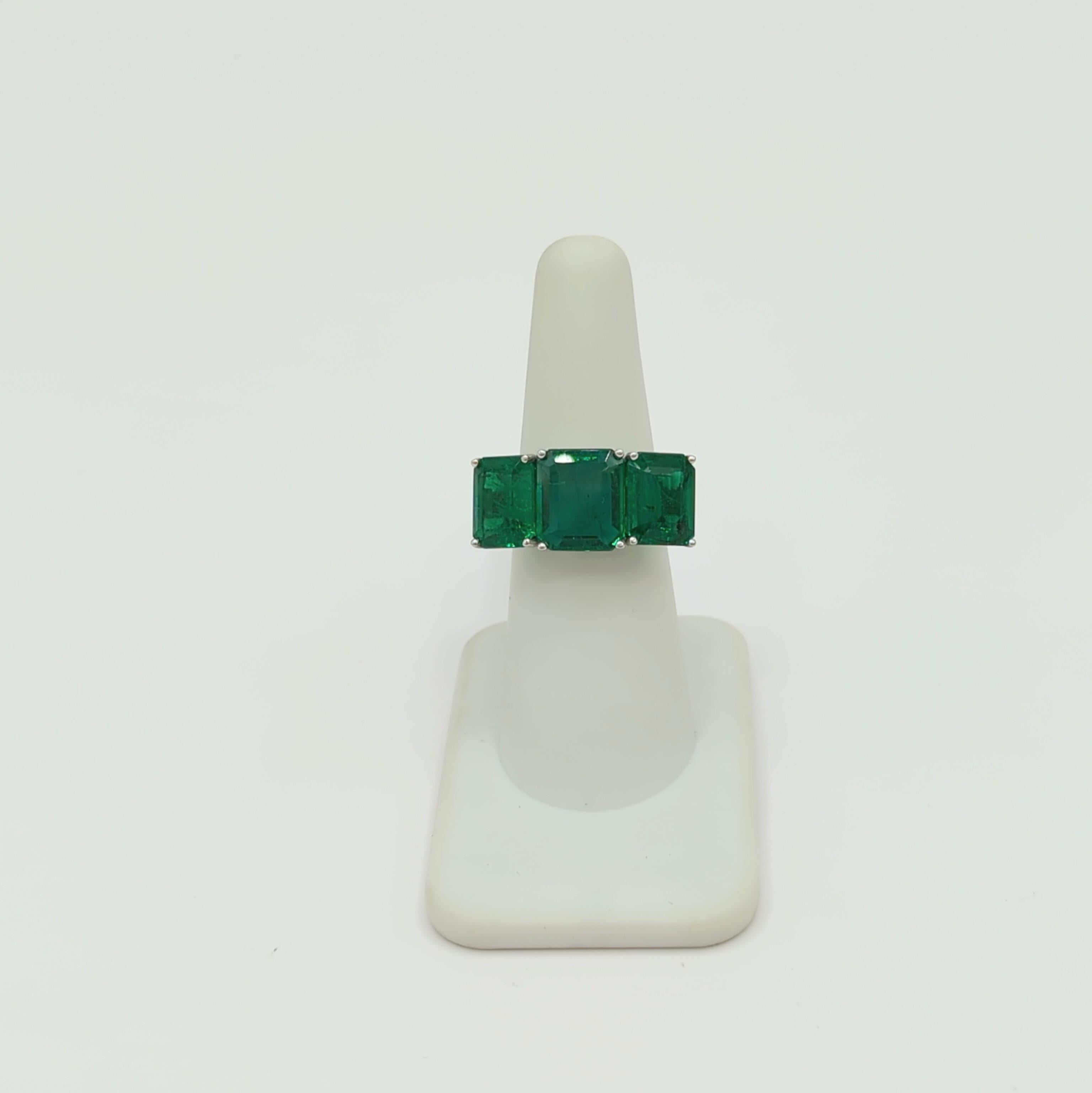 Emerald Cut Emerald Three Stone Ring in Platinum For Sale