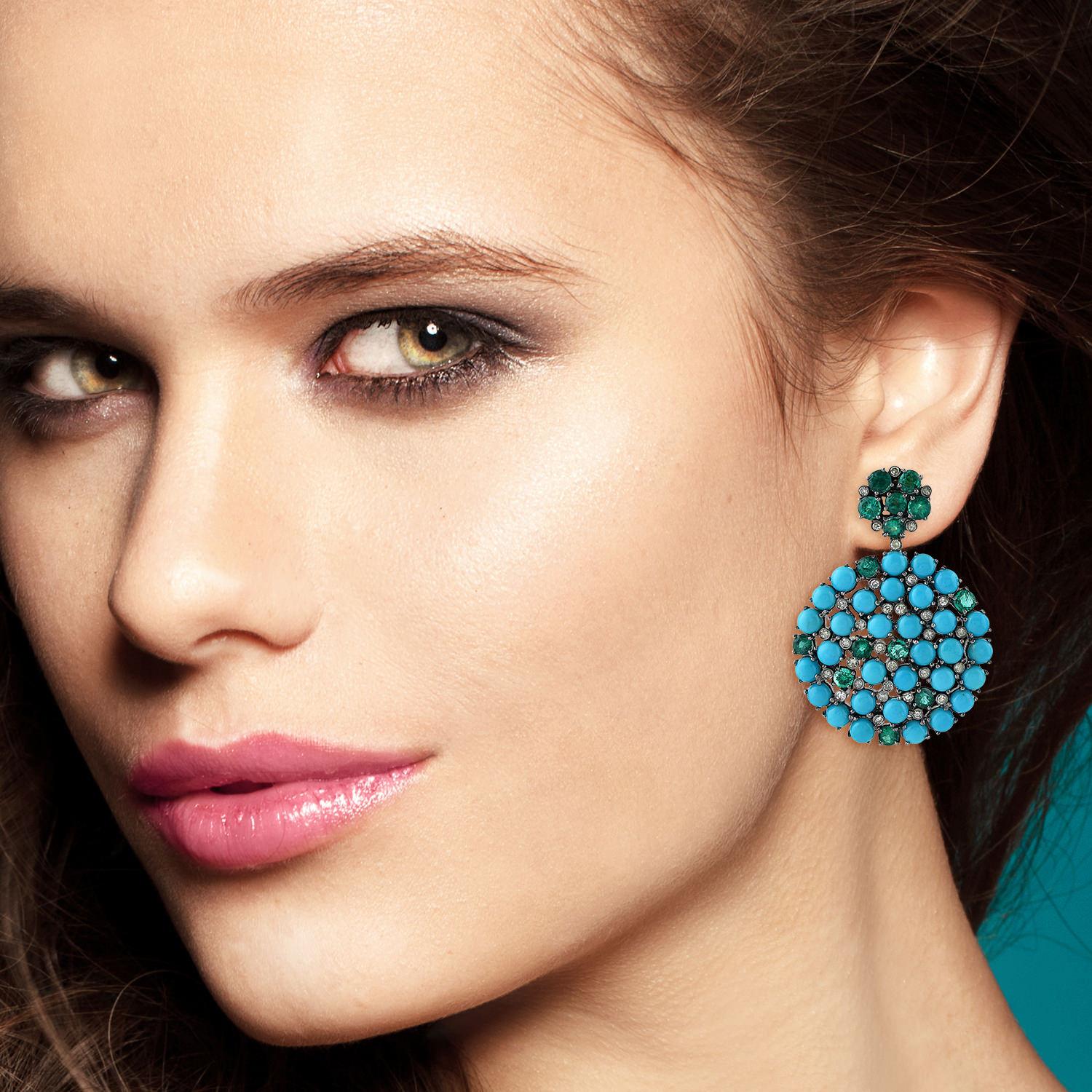 Handcrafted from 14-karat gold & sterling silver, these beautiful earrings are set with 4.5 carats emerald, 15.02 carats Turquoise and 1.05 carats of glimmering diamonds.

FOLLOW  MEGHNA JEWELS storefront to view the latest collection & exclusive