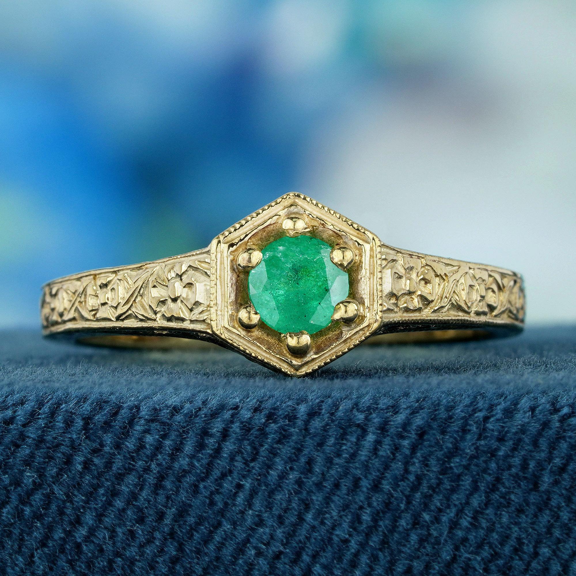 This vintage-style emerald ring showcases a stunning natural emerald, radiating its rich green hue at the center. The emerald is set in a beautifully crafted band with intricate detailing, offering a timeless, elegant design. A perfect piece for