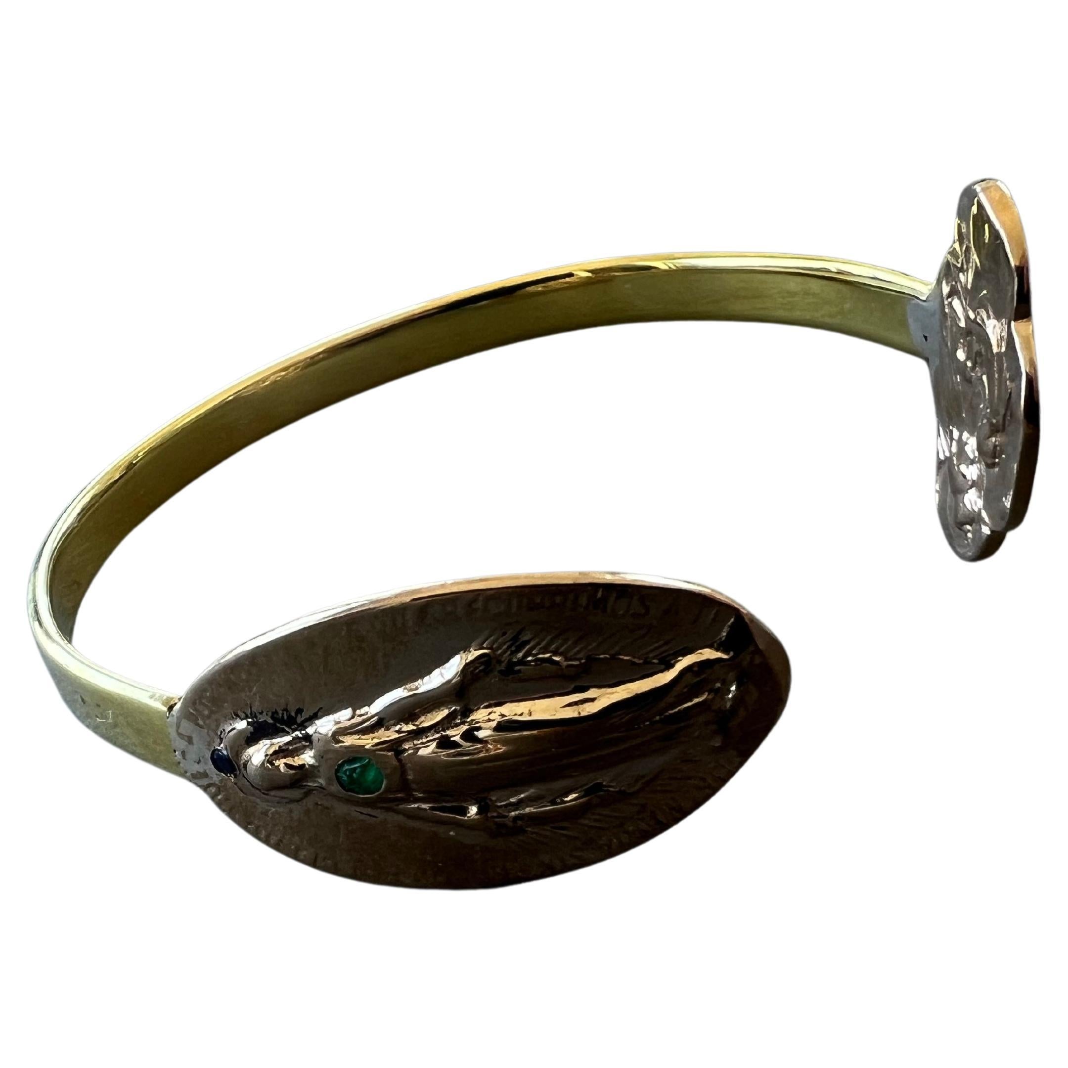 Emerald Virgin Mary Bangle Bracelet Cuff Spiritual Religious

This Emerald Virgin Mary Bangle Bracelet Cuff is a beautiful and meaningful piece of jewelry that combines fashion with spirituality. The cuff features a stunning Emerald centerpiece,