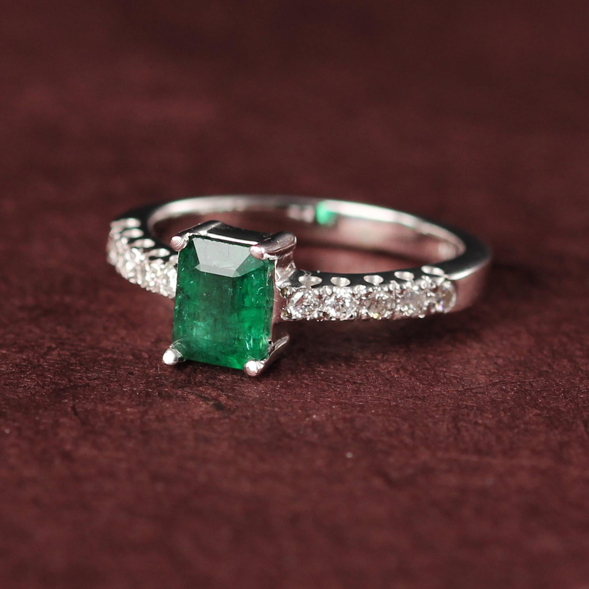 Classic Emerald gemstone - emerald-cut shape Ring
Plus white Gold and Diamonds 
Total Emerald 0.80 carat. (7 x 5 mm) 
Nice Green Color and has natural inclusions
Total Diamonds 0.20 carat G-VS
Total Gold 14K White Gold 3.30 Grams.
Finger Size