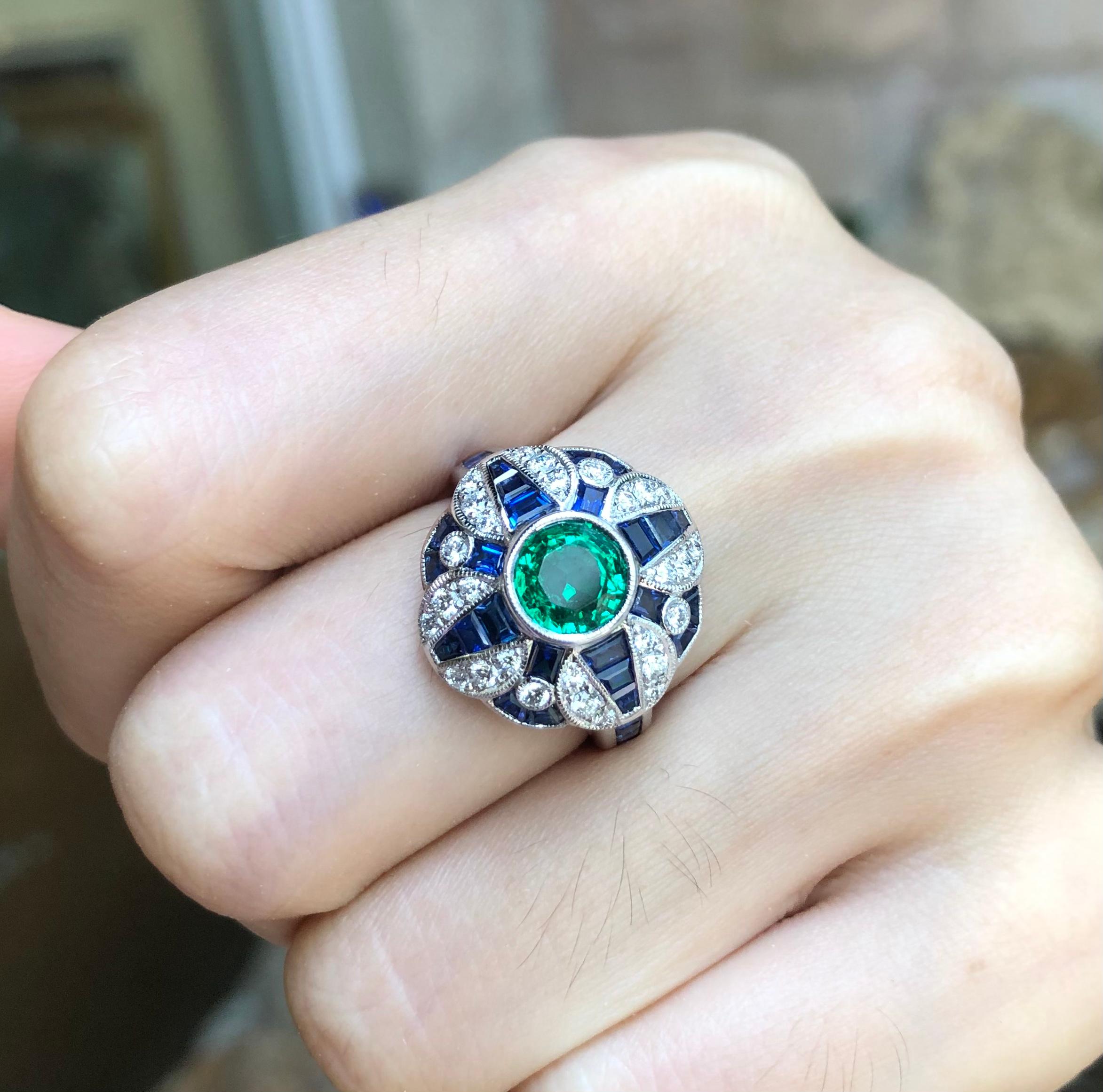 Emerald 0.97 carats with Blue Sapphire 3.42 carats and Diamond  0.34 carat Ring set in 18 Karat White Gold Settings 

Width:  1.7 cm 
Length:  1.7 cm
Ring Size: 53
Total Weight: 7.67 grams


