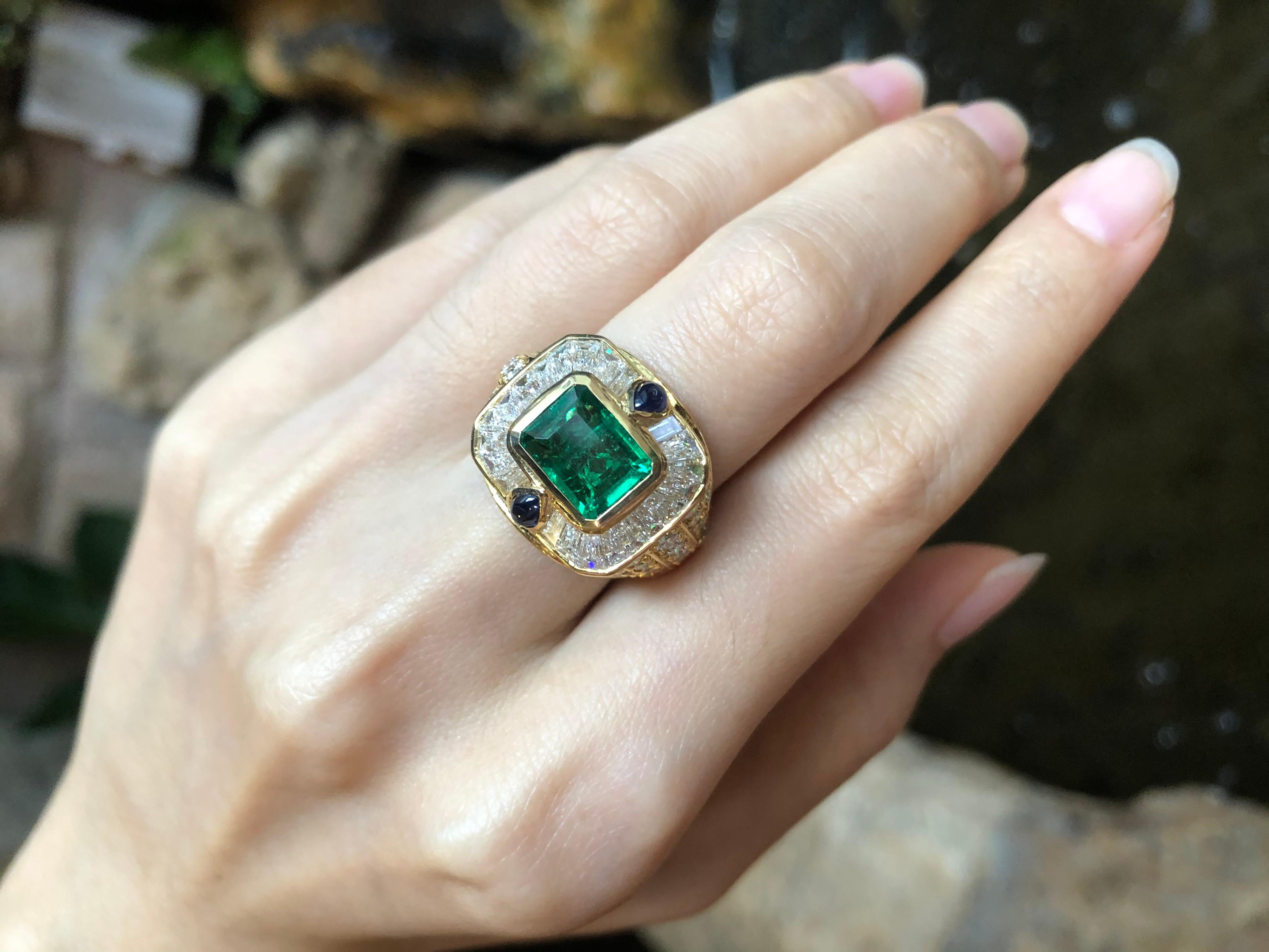 Emerald 2.62 carats with Diamond 5.10 carats and Cabochon Blue Sapphire 0.47 carat Ring set in 18 Karat Gold Settings

Width:  1.0 cm 
Length: 0.8 cm
Ring Size: 54
Total Weight: 13.68 grams

