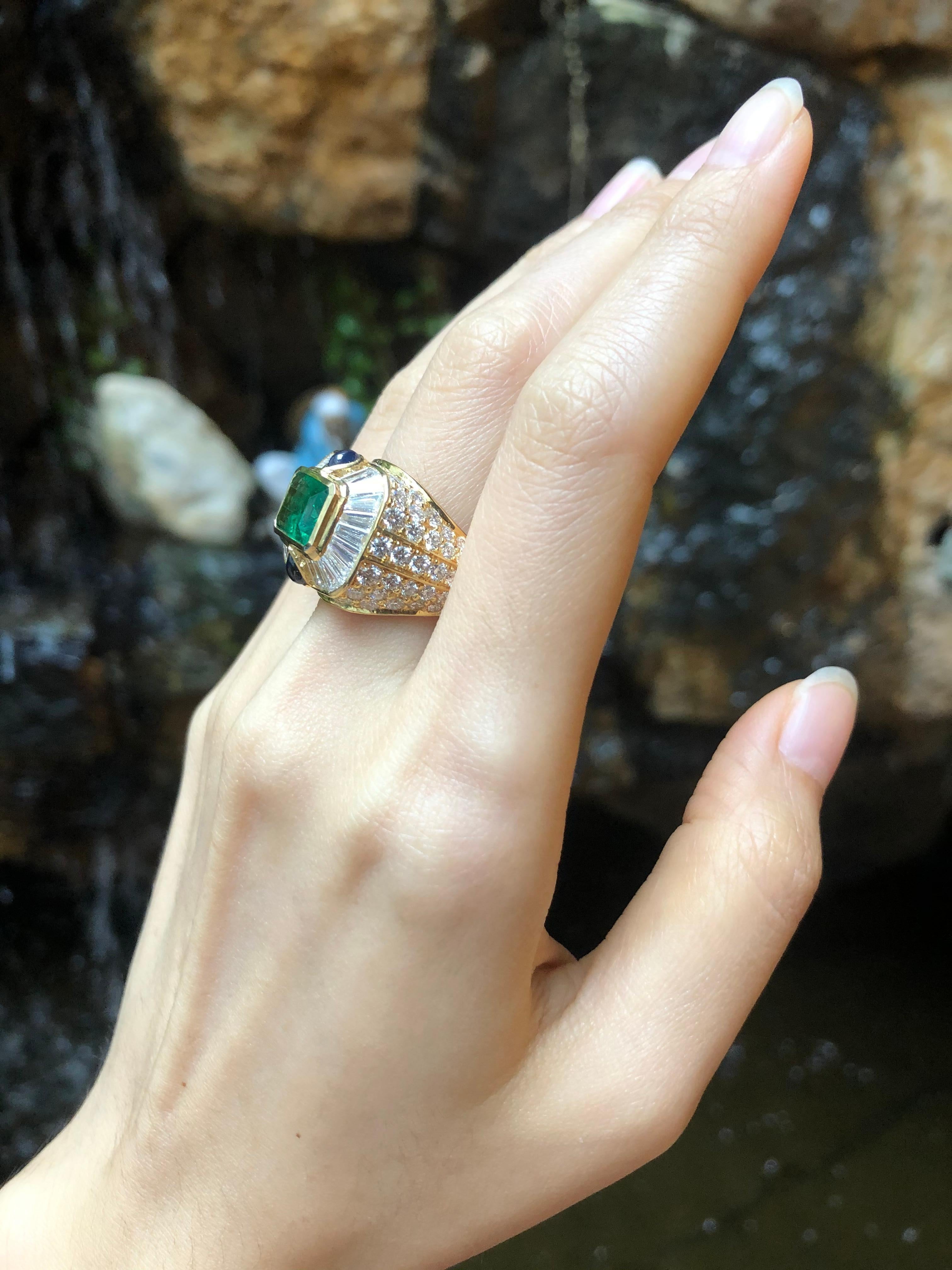 Emerald Cut Emerald with Diamond and Cabochon Blue Sapphire Ring in 18 Karat Gold Settings For Sale