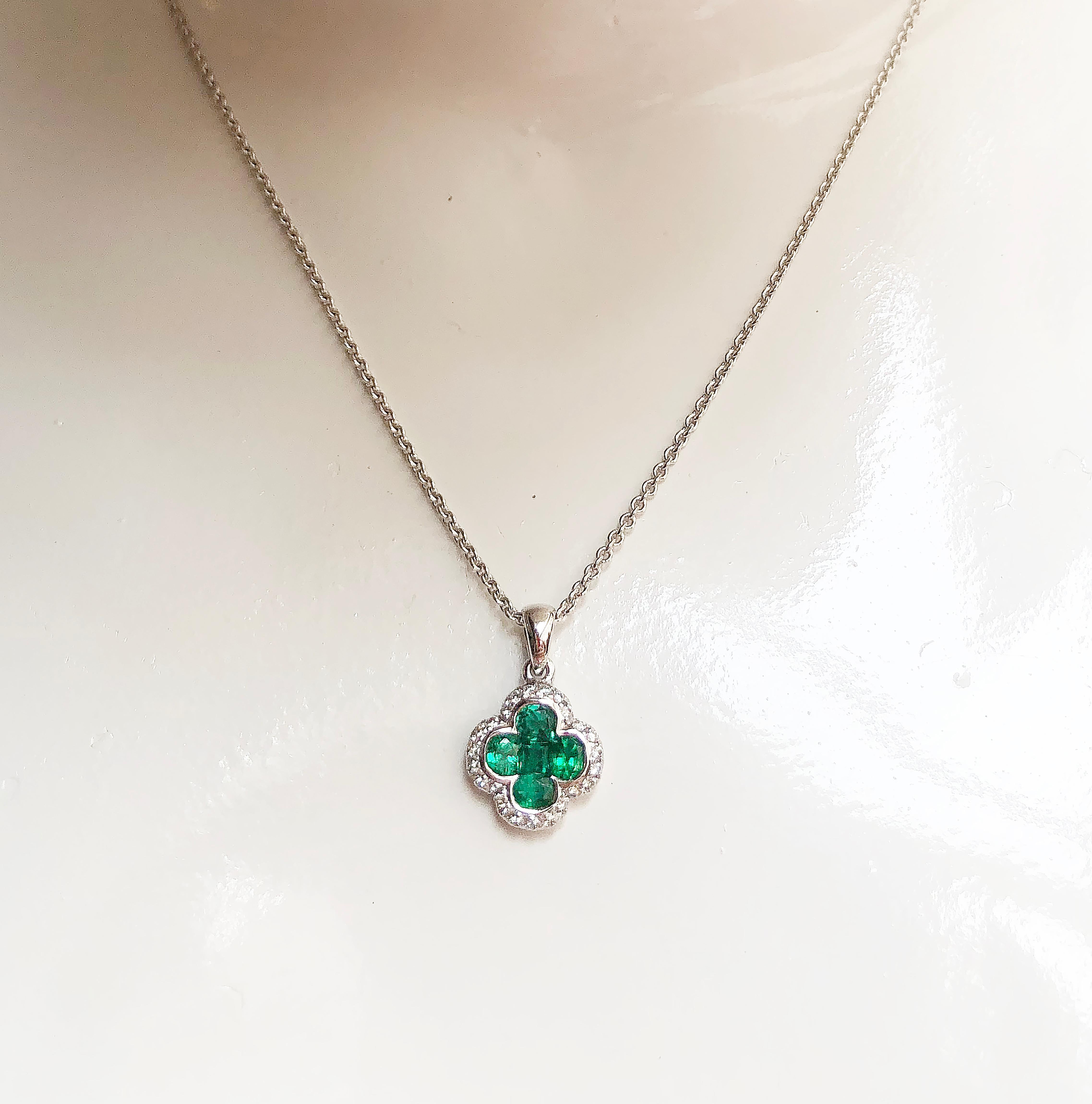 Emerald 0.80 carat with Diamond 0.15 carat Pendant set in 18 Karat Gold Settings
(chain not included)

Width:  1.1 cm 
Length: 1.8 cm
Total Weight: 1.60 grams

