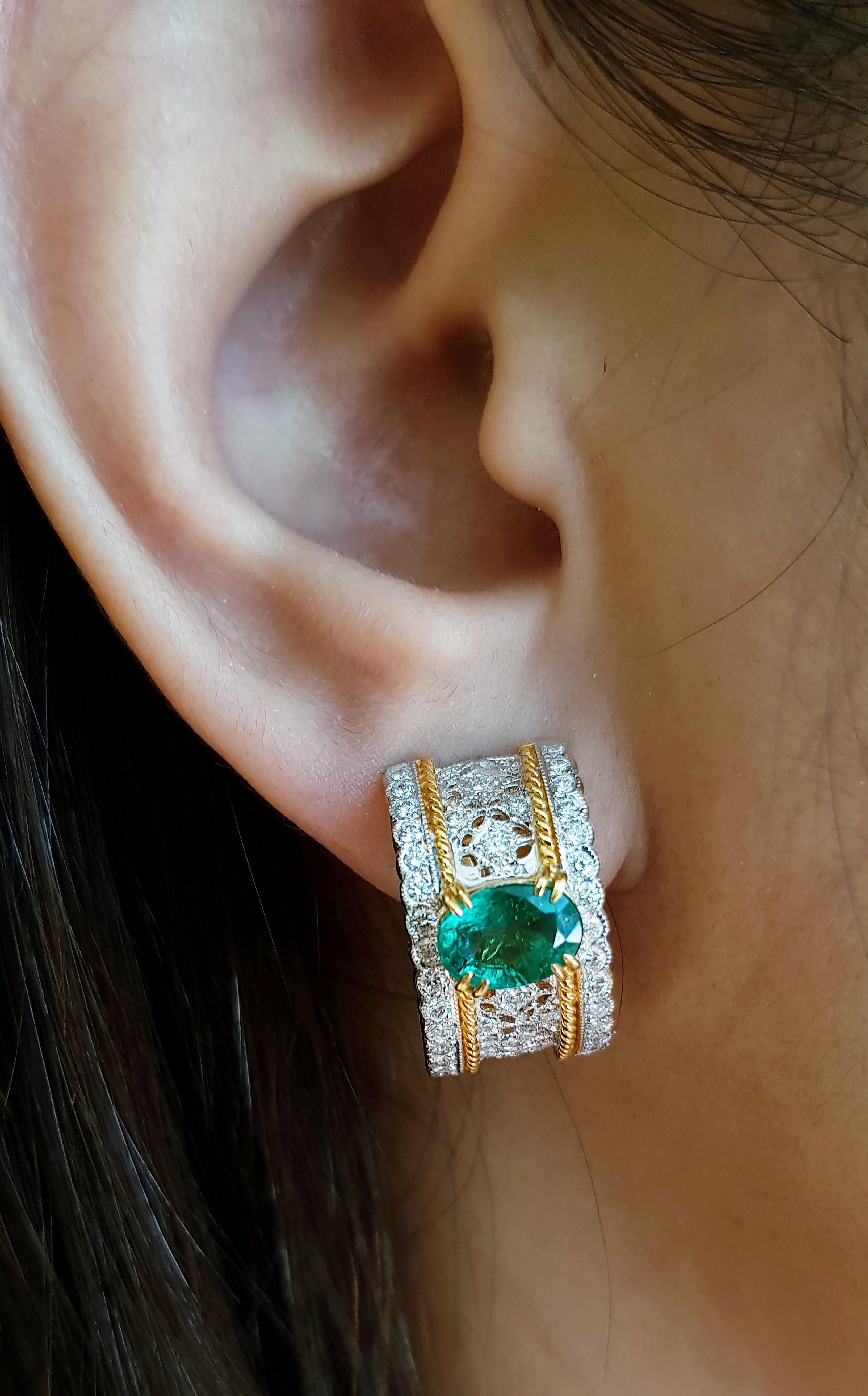 Emerald 2.29 carats with Diamond 0.97 carat Earrings set in 18 Karat Gold Settings

Width:  1.1 cm 
Length: 1.9 cm
Total Weight: 10.69 grams

