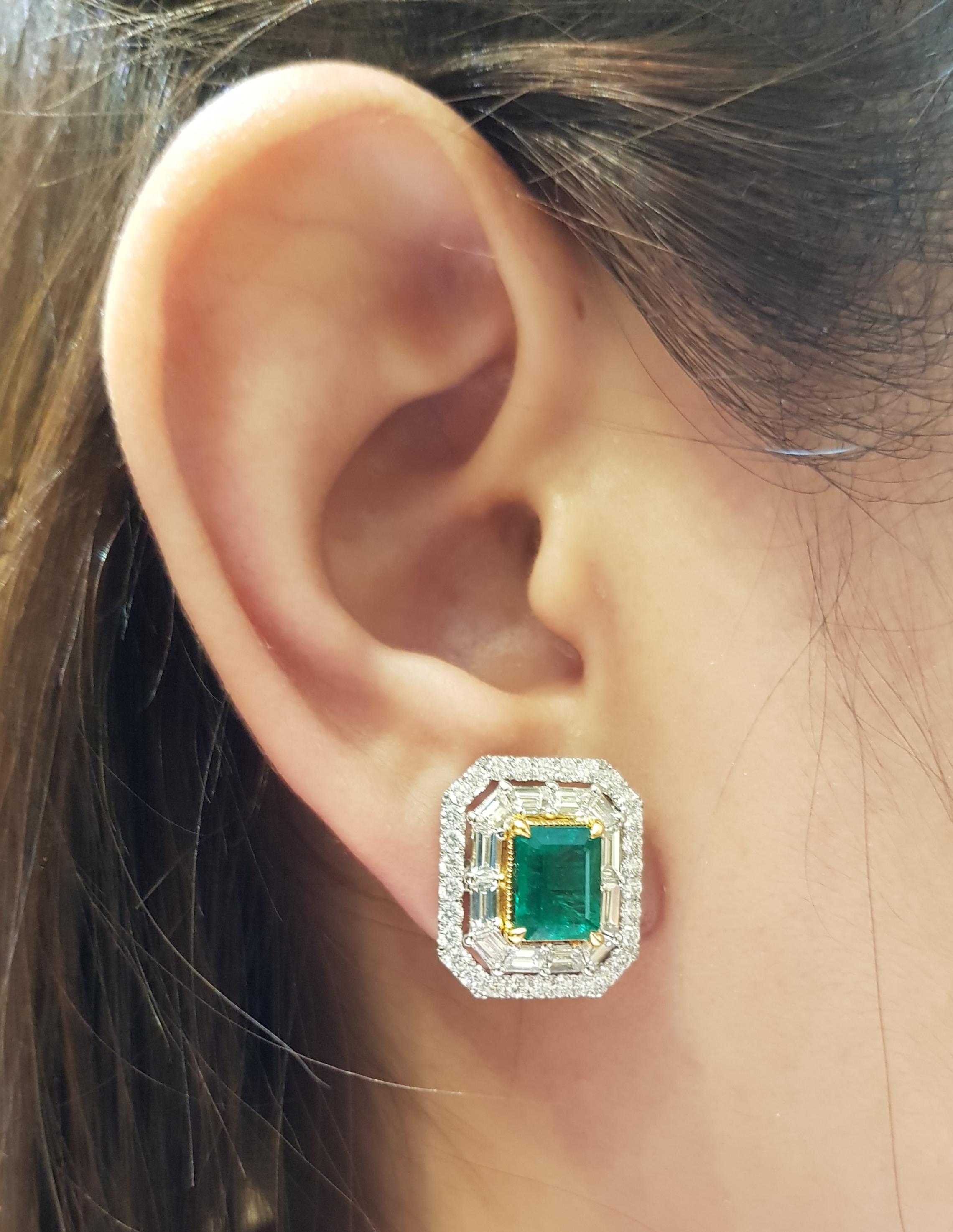 Emerald 3.92 carats with Diamond 3.50 carats Earrings set in 18 Karat White Gold Settings

Width:  1.8 cm 
Length: 1.5 cm
Total Weight: 15.24 grams

