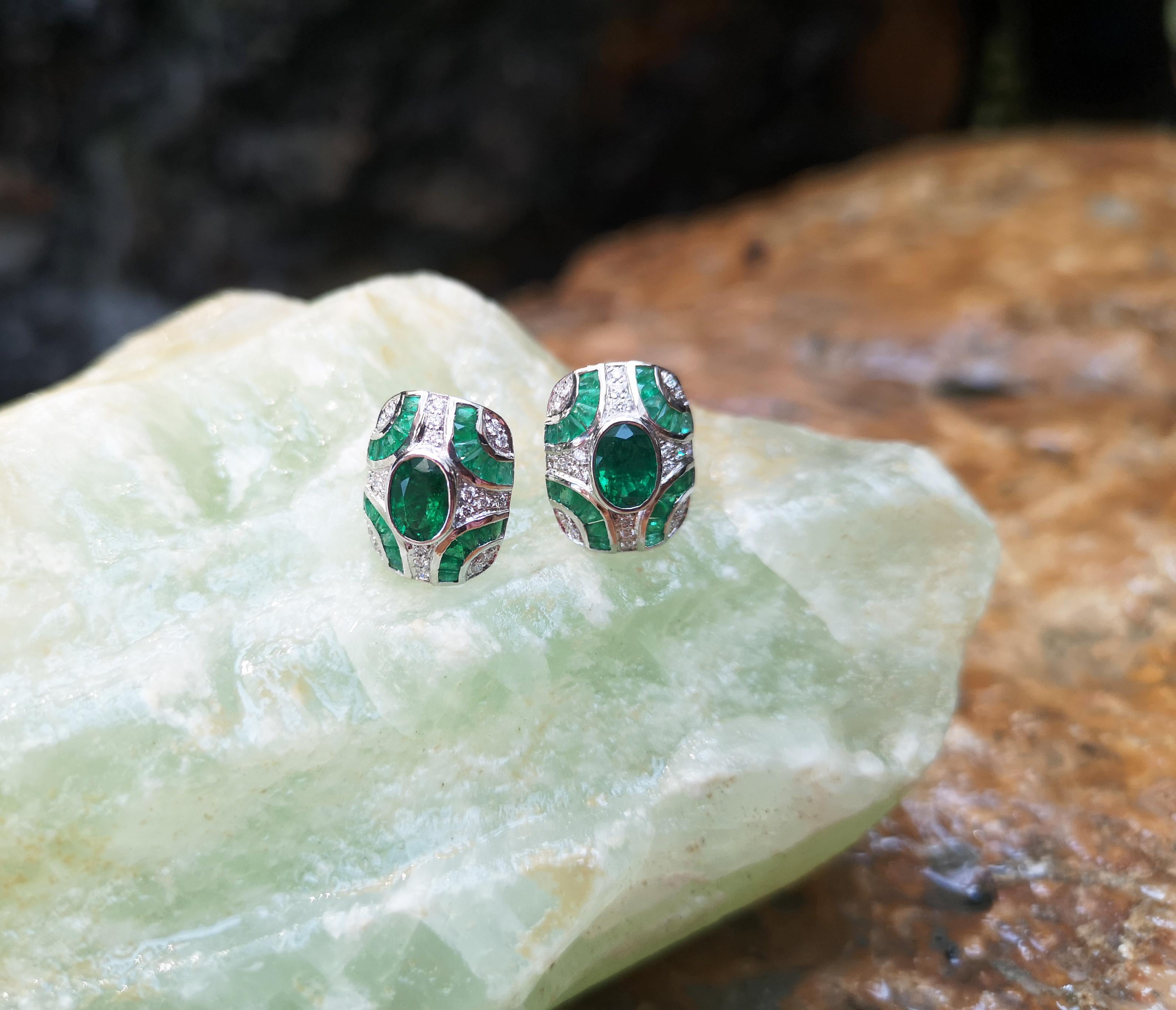 Oval Cut Emerald with Diamond Earrings Set in 18 Karat White Gold Settings