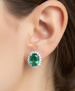 Emerald with Diamond Earrings set in 18K White Gold Settings