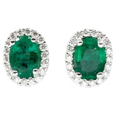 Emerald with Diamond Earrings set in 18K White Gold Settings