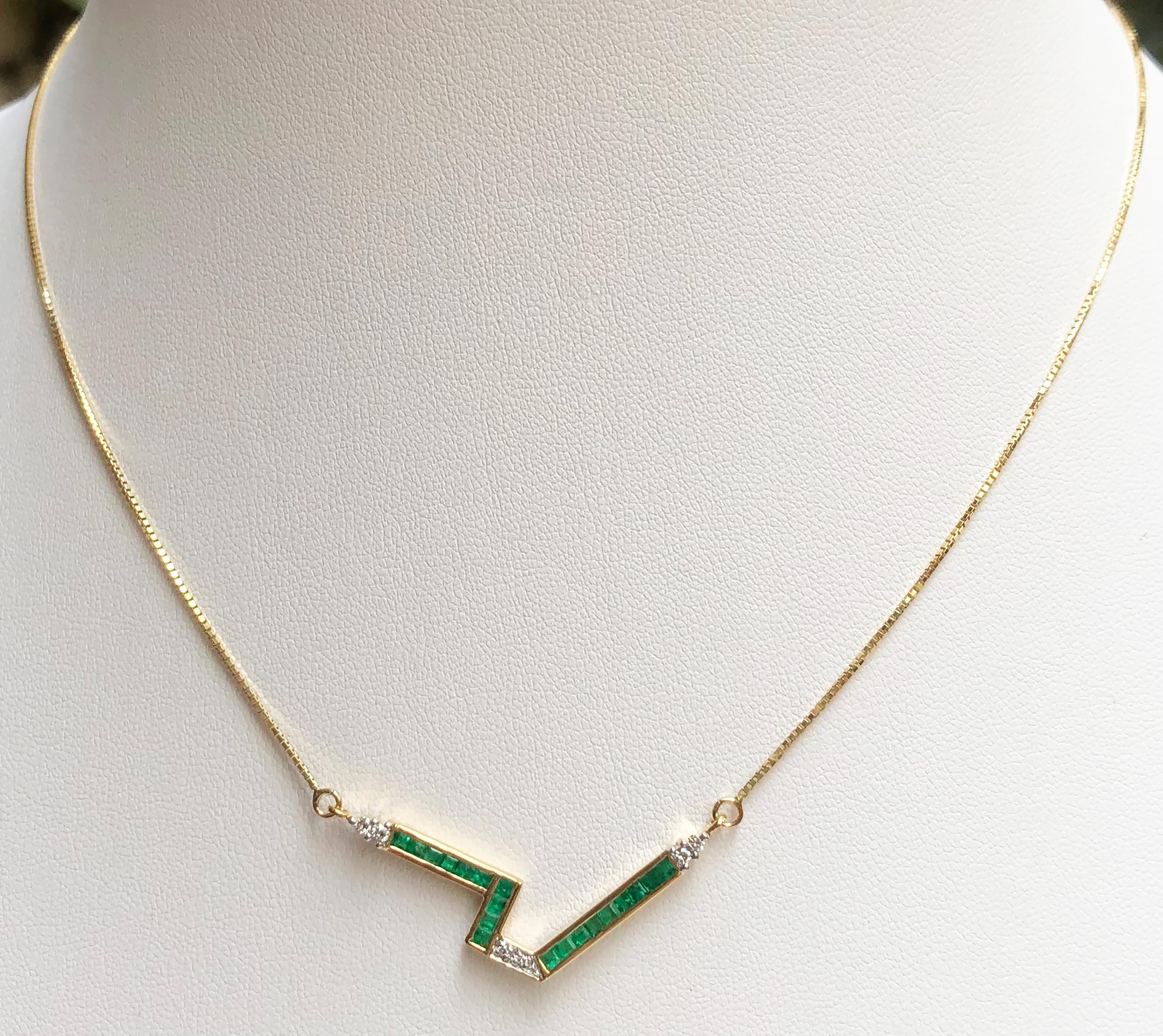 Emerald 0.56 carat with Diamond 0.09 carat Necklace set in 18 Karat Gold Settings

Width:  3.8 cm 
Length: 41.0 cm
Total Weight: 4.23 grams

