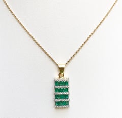 Emerald with Diamond Pendant Set in 18 Karat Gold Setting