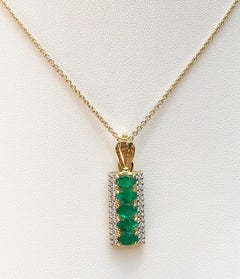 Emerald with Diamond Pendant Set in 18 Karat Gold Setting