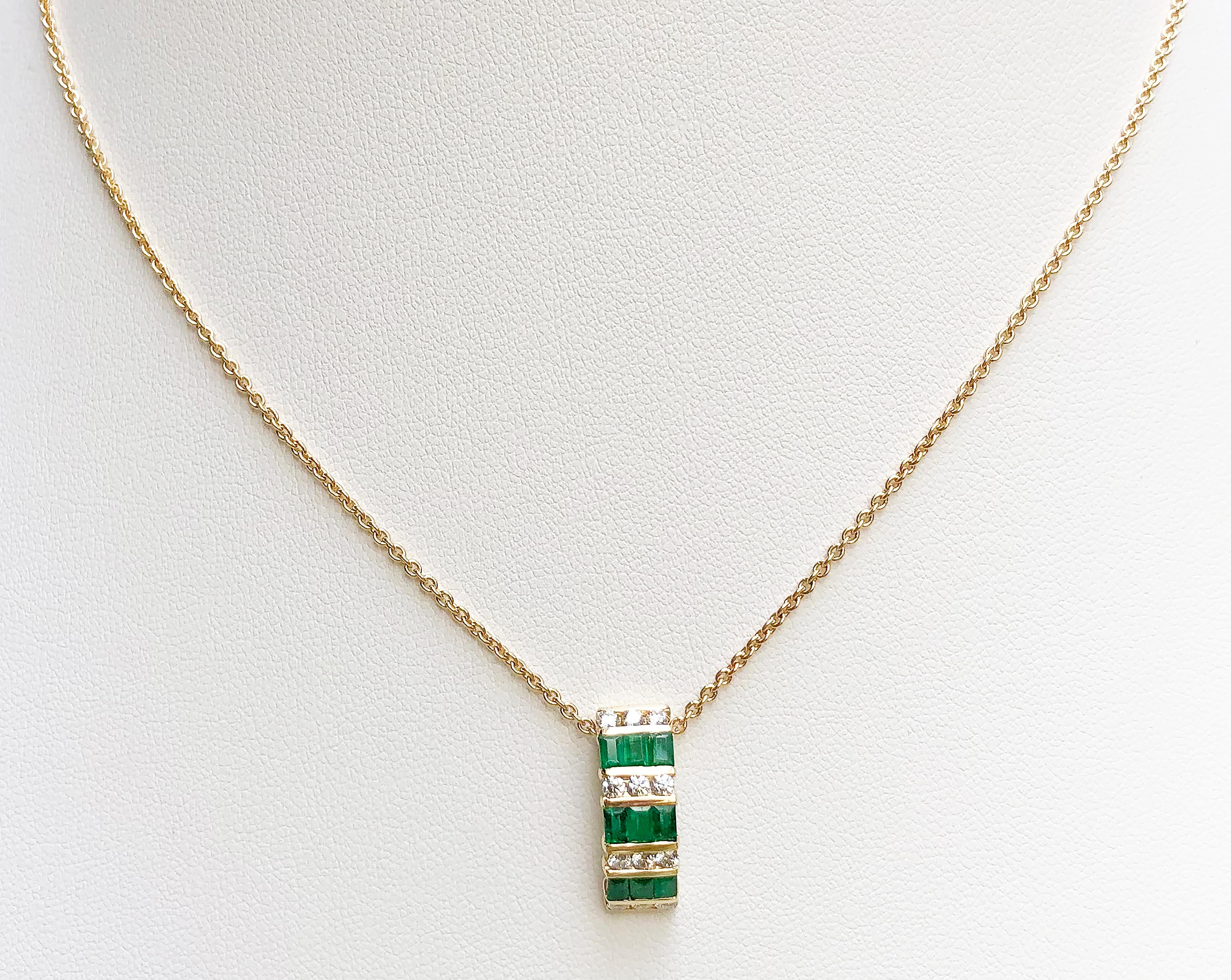 Emerald 0.61 carat with Diamond 0.35 carat Pendant set in 18 Karat Gold Settings
(chain not included)

Width:  0.6 cm 
Length: 1.9 cm
Total Weight: 2.48 grams

