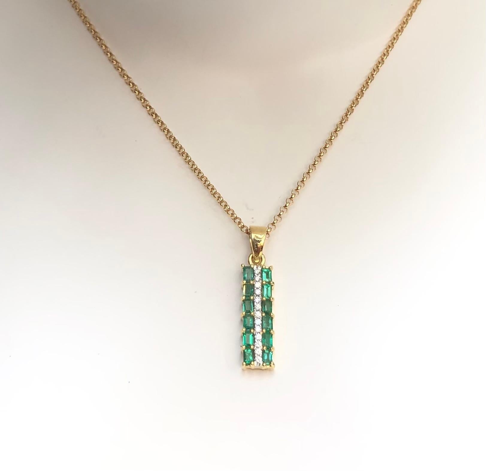 Emerald 0.84 carat with Diamond 0.12 carat Pendant set in 18 Karat Gold Settings
(chain not included)

Width:  0.5 cm 
Length: 2.7 cm
Total Weight: 3.77 grams

