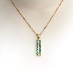 Emerald  with Diamond Pendant set in 18 Karat Gold Settings