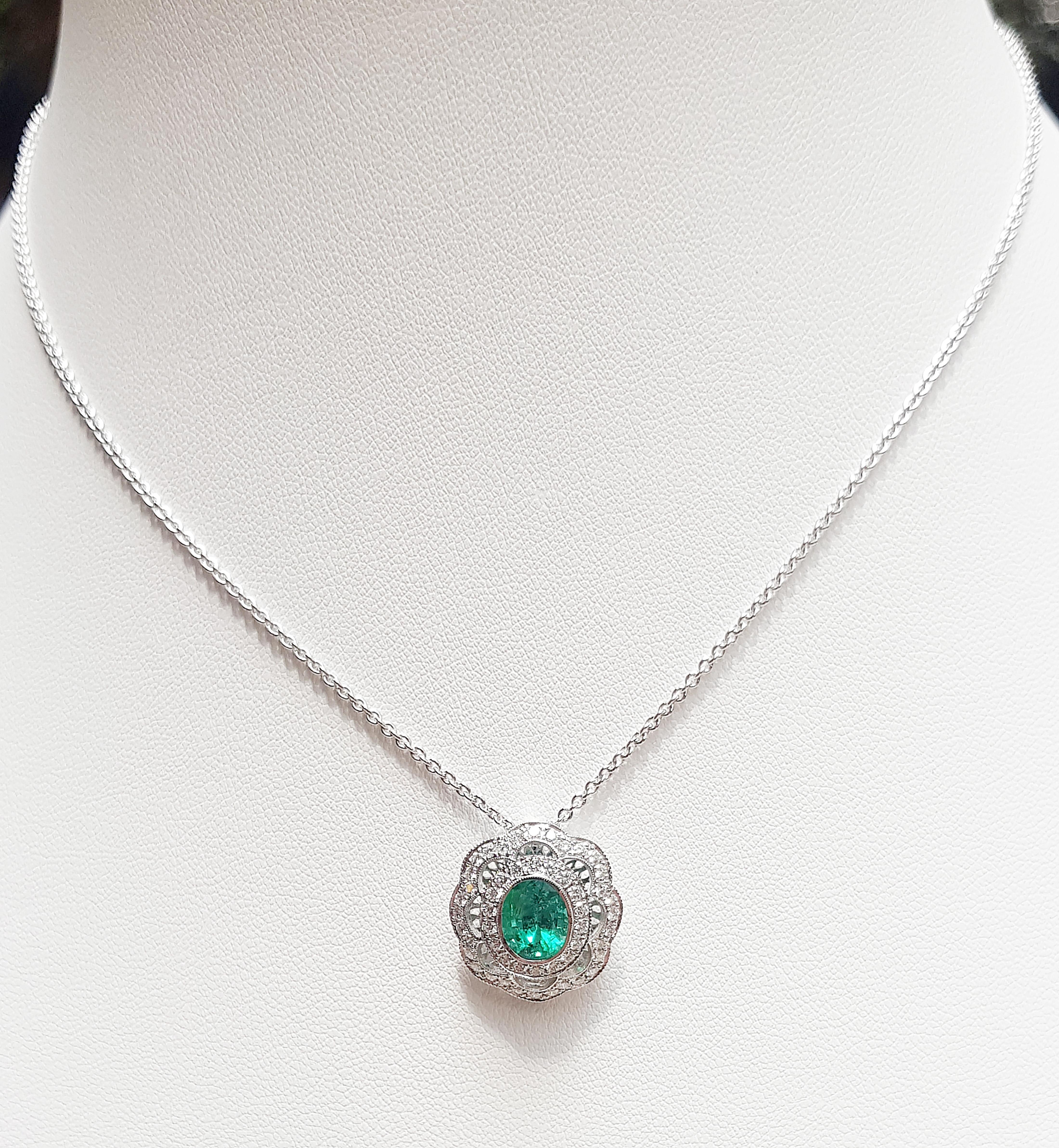 Emerald 1.46 carats with Diamond 0.59 carat Pendant set in 18 Karat White Gold Settings
(chain not included)

Width:  1.8 cm 
Length: 1.9 cm
Total Weight: 2.86 grams

