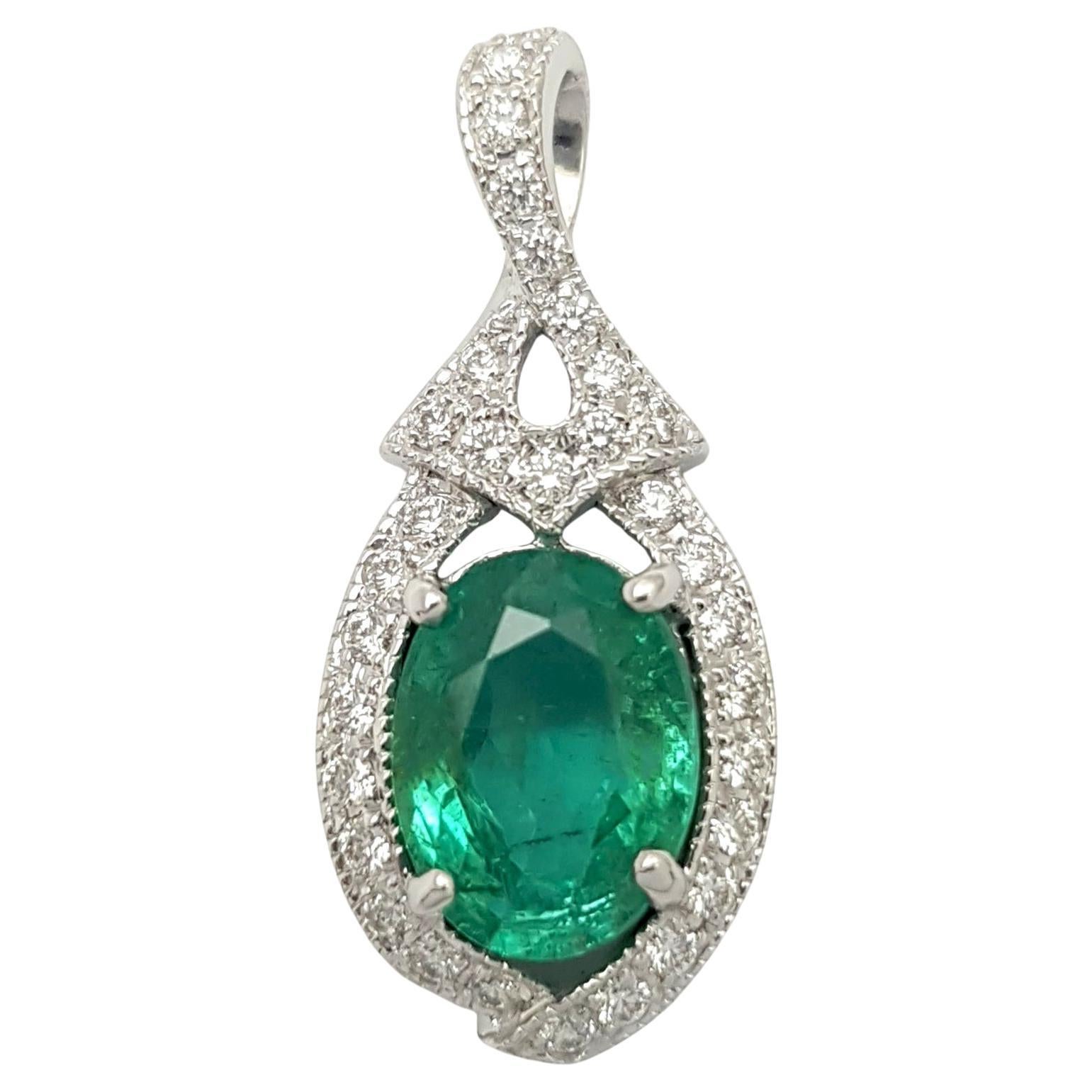 Emerald with Diamond Pendant set in 18K White Gold Settings