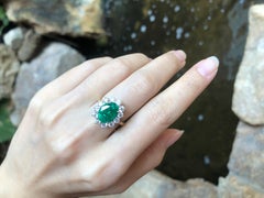 Emerald with Diamond Ring Set in 18 Karat Gold Settings