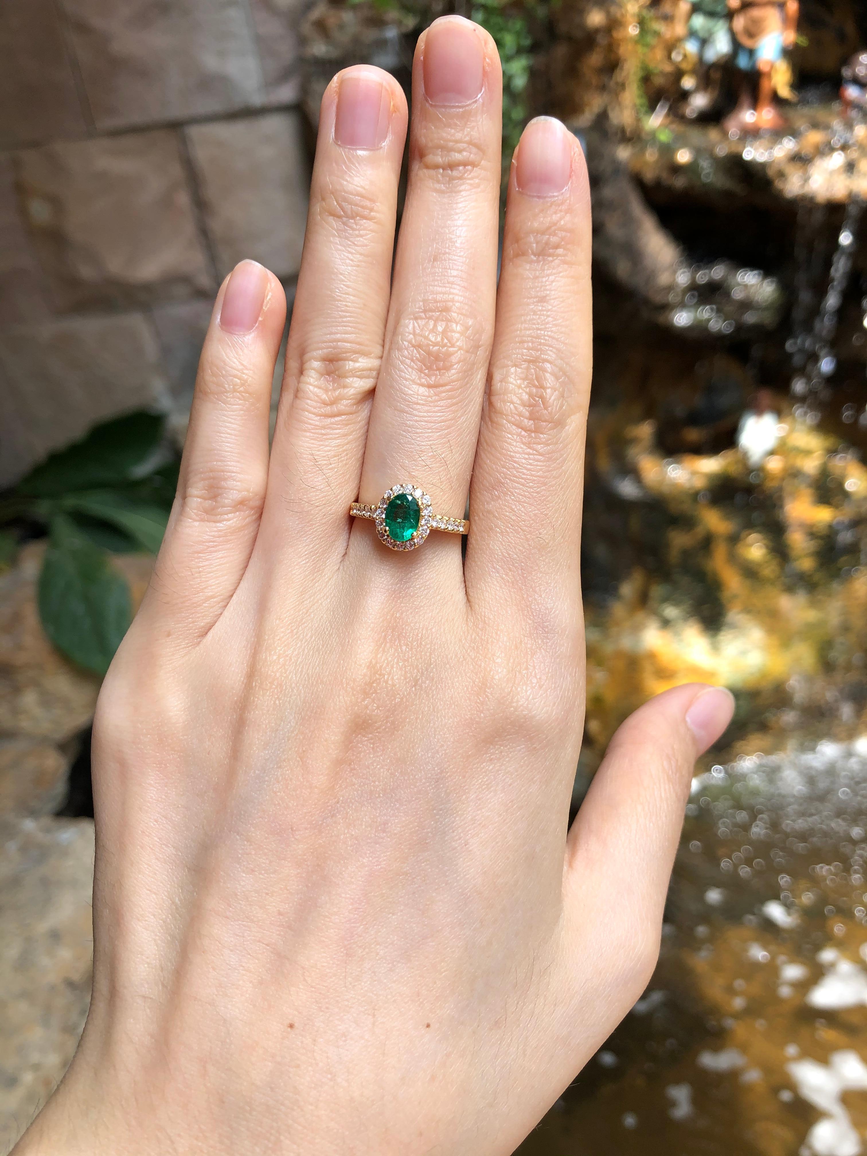Emerald 0.76 carat with Diamond 0.32 carat Ring set in 18 Karat Gold Settings

Width:  0.8 cm 
Length: 1.0 cm
Ring Size: 52
Total Weight: 3.49 grams

