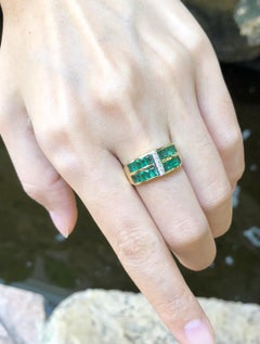 Emerald with Diamond Ring Set in 18 Karat Gold Settings