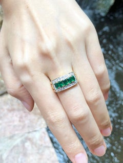 Emerald with Diamond Ring Set in 18 Karat Gold Settings