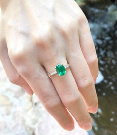 Emerald with Diamond Ring Set in 18 Karat Gold Settings