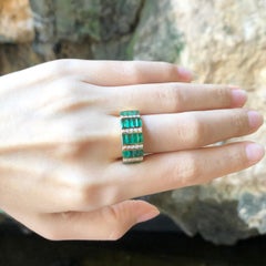 Emerald with Diamond Ring set in 18 Karat Gold Settings
