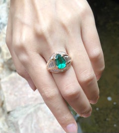 Emerald with Diamond Ring Set in 18 Karat Rose Gold Settings