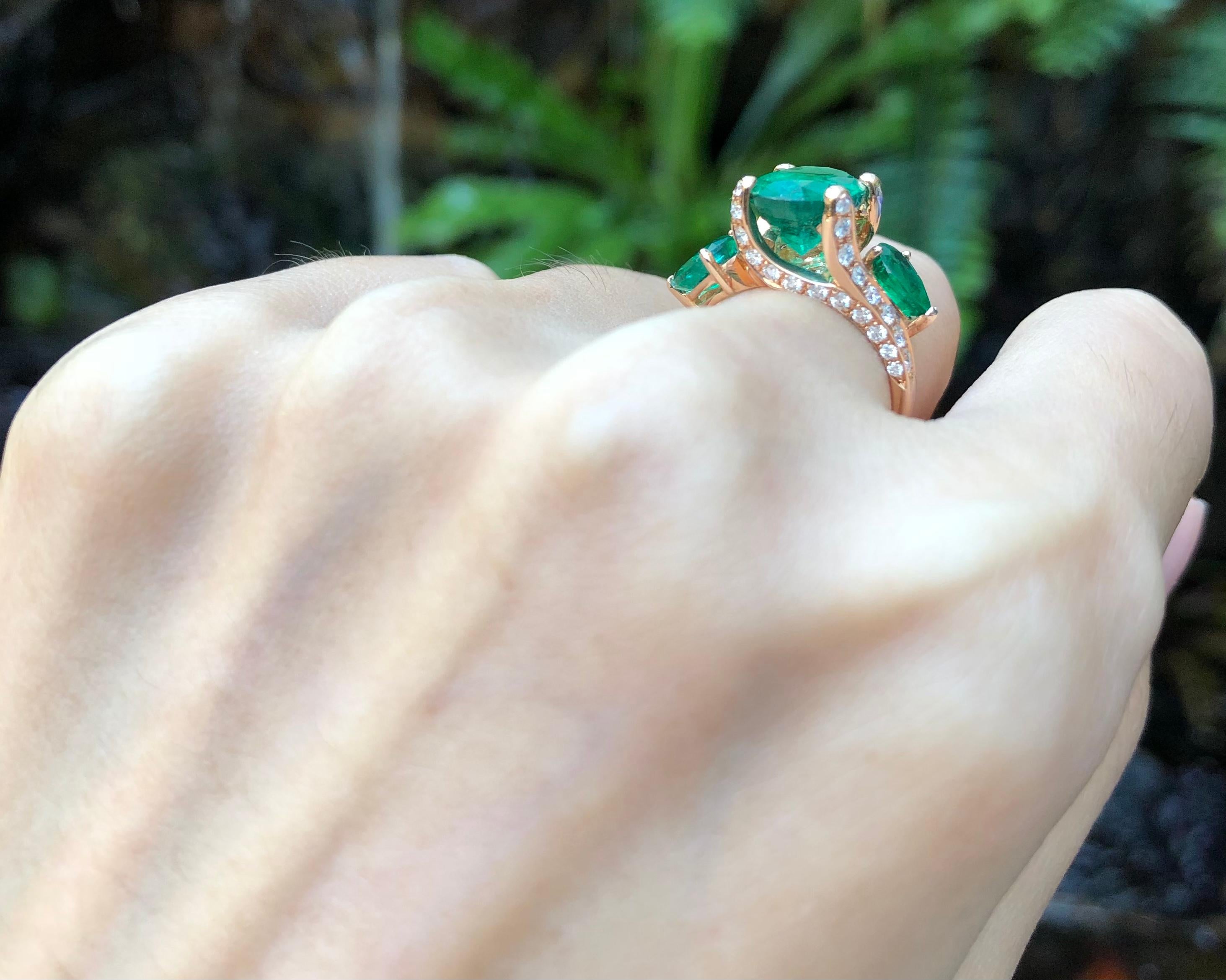 Contemporary Emerald with Diamond Ring set in 18 Karat Rose Gold Settings For Sale