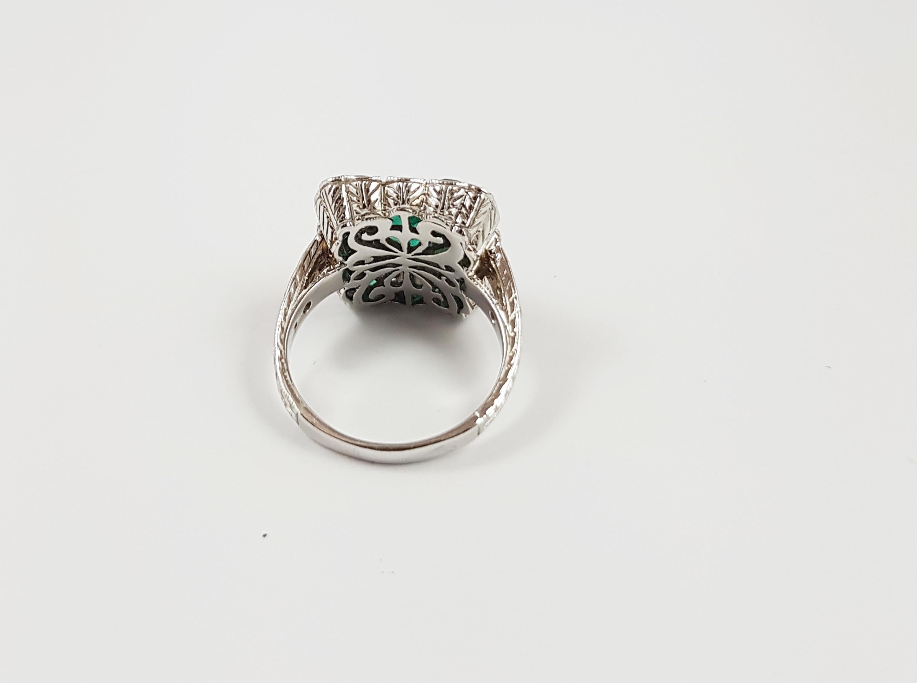Emerald 1.18 carats with Emerald 1.40 carats and Diamond 0.67 carat Ring set in 18 Karat White Gold Settings

Width: 1.5 cm
Length: 1.5 cm 
Ring Size: 52

