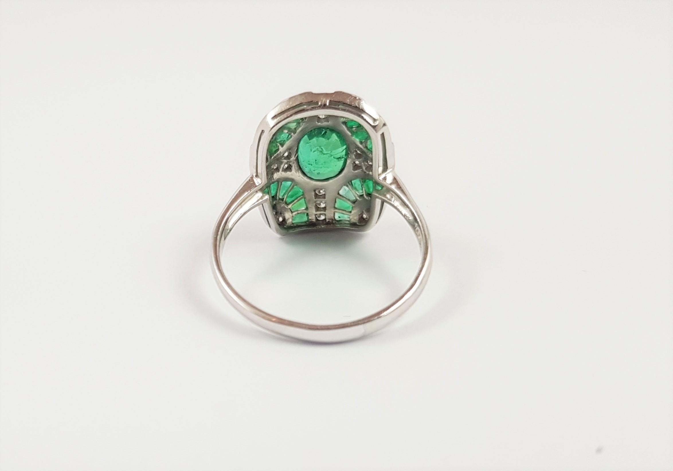 Emerald 0.80 carat with Emerald 0.92 carat and Diamond 0.13 carat Ring set in 18 Karat White Gold Settings

Width: 1.1 cm
Length: 1.6 cm 
Ring Size: 51

