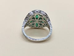 Emerald with Diamond Ring Set in 18 Karat White Gold Settings