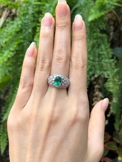 Emerald with Diamond Ring Set in 18 Karat White Gold Settings