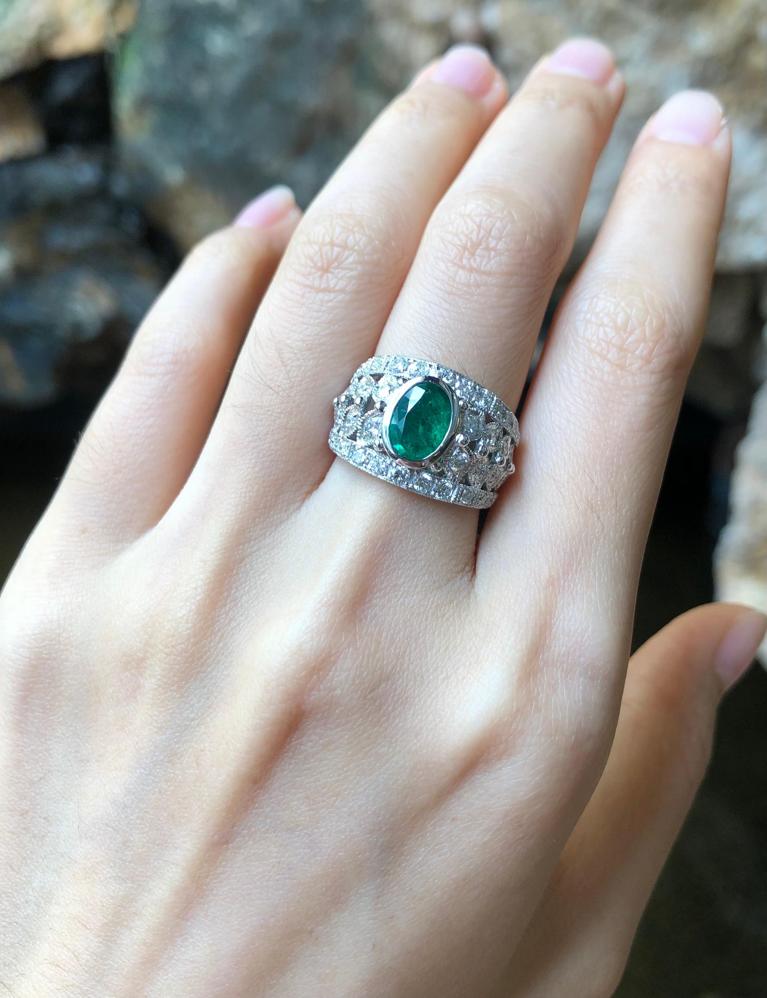 Emerald 0.90 carat with Diamond 0.86 carat Ring set in 18 Karat White Gold Settings

Width:  1.1 cm 
Length:  1.2 cm
Ring Size: 51
Total Weight: 7.21 grams

