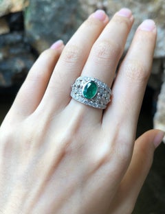 Emerald with Diamond Ring Set in 18 Karat White Gold Settings