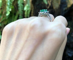 Emerald with Diamond Ring Set in 18 Karat White Gold Settings